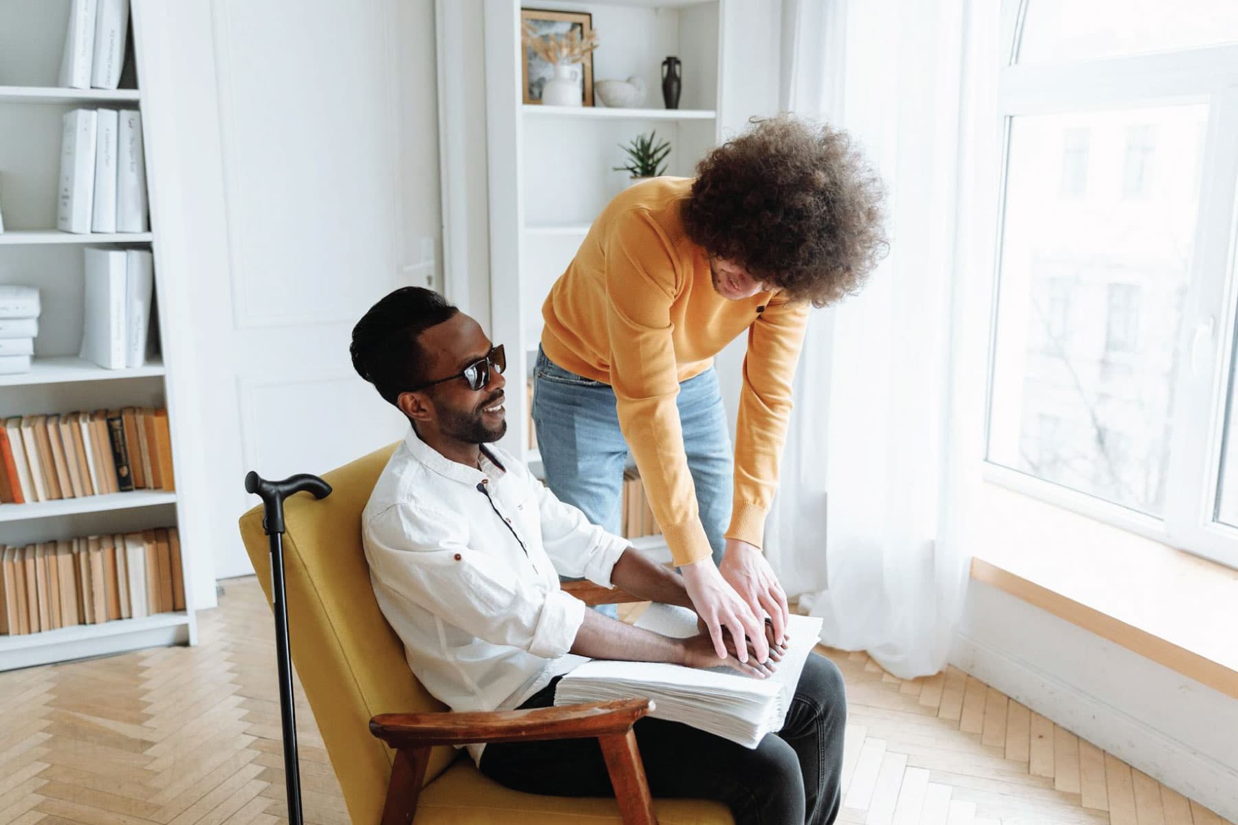 Support worker assisting a participant with guided upper-body movement