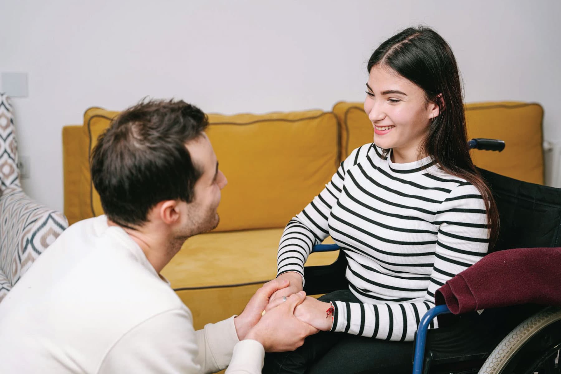 Support worker assisting a participant with guided upper-body movement