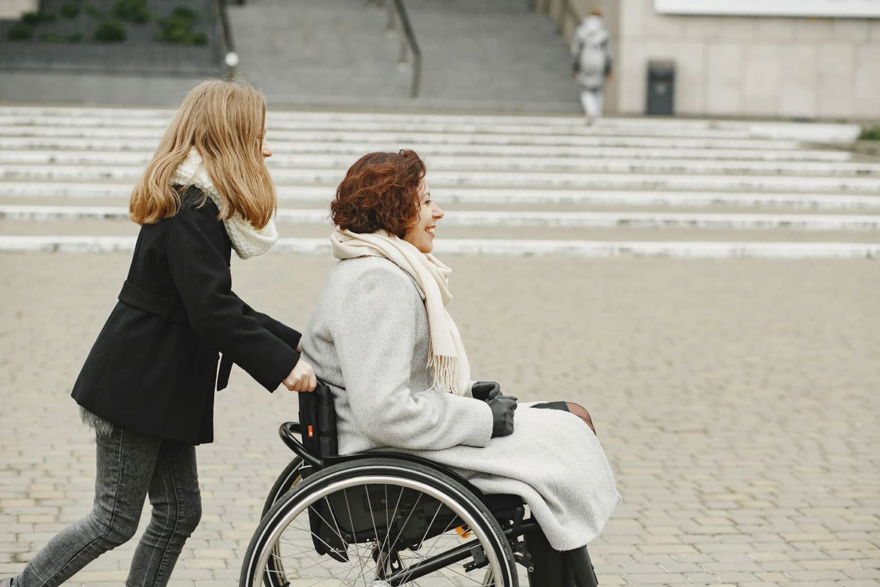 Support worker assisting a participant with guided upper-body movement